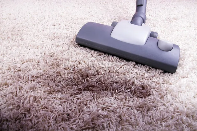 Removing carpet stains with a vacuum cleaner
