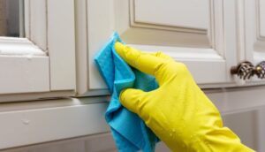 removing grease buildup from kitchen cabinets near stove
