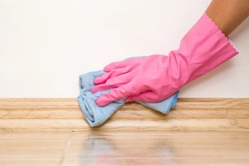 cleaning dust from baseboards and hidden areas in Pasadena home