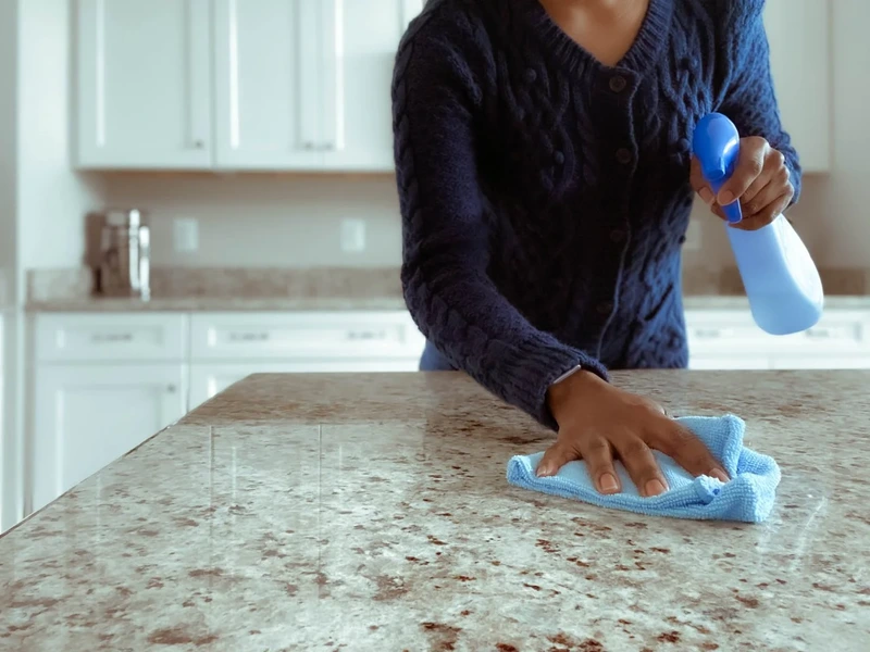 cleaner wiping kitchen countertops during house cleaning Pasadena MD