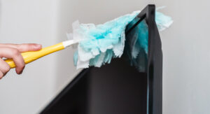 professional cleaner removing dust during deep cleaning in Maryland home