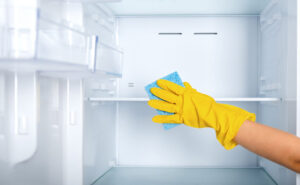 professional cleaner deep cleaning kitchen cabinets in Maryland home